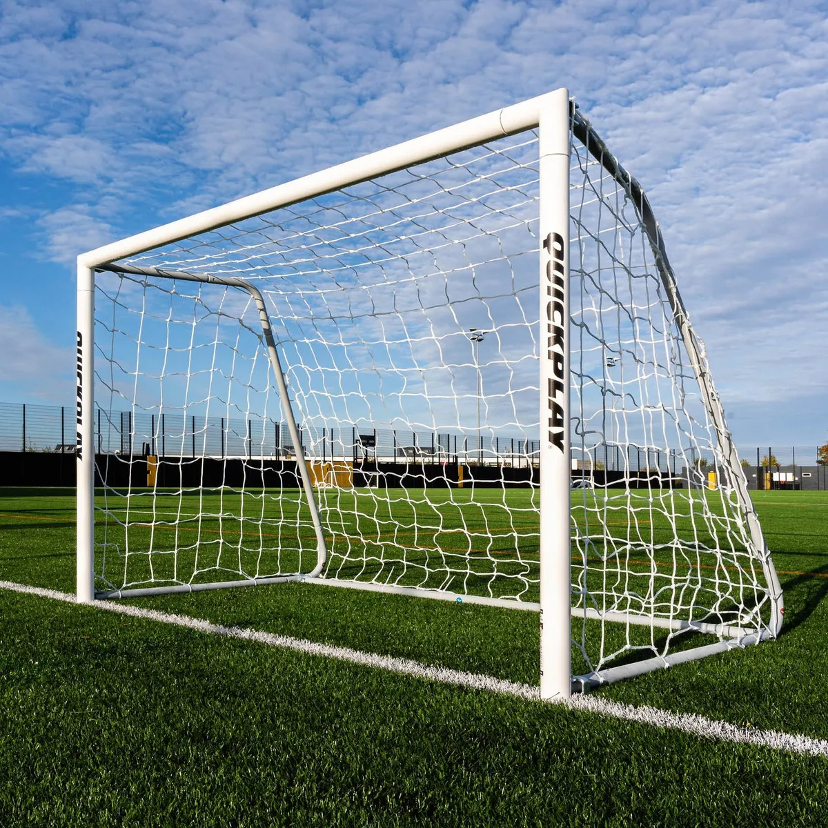 A white QUICKPLAY football goal on an artificial grass pitch