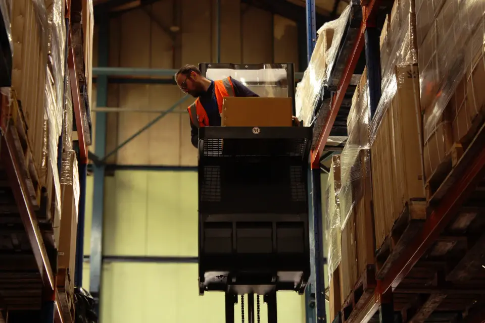 MCF warehouse operative picking stock from high racking